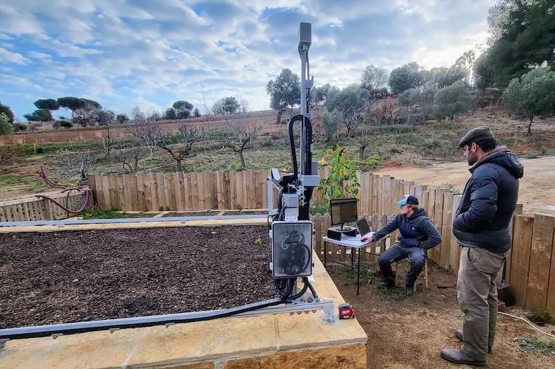 Students learning with FarmBot at workshop